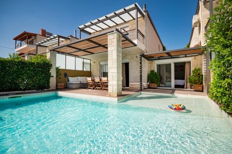 Property building, Patio, Day, Pool view, Swimming pool