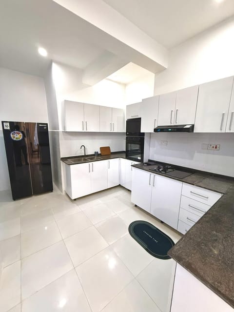 Kitchen or kitchenette, dishwasher, oven, stove