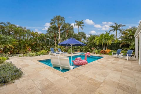 Canal Walk: Tiki Bar, Mini Golf, Pool & Spa On Canal by Anna Maria Life Vacation Rentals House in Holmes Beach