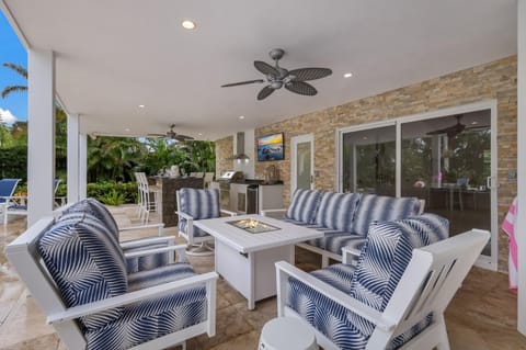 Canal Walk: Tiki Bar, Mini Golf, Pool & Spa On Canal by Anna Maria Life Vacation Rentals House in Holmes Beach