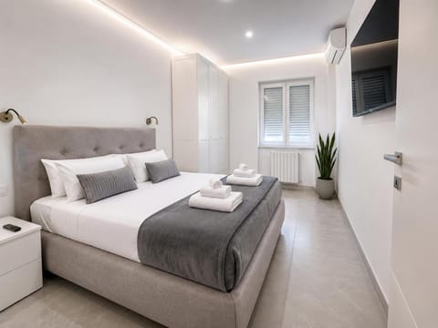 Property building, Bed, TV and multimedia, Bedroom, locker, towels, wardrobe, air conditioner