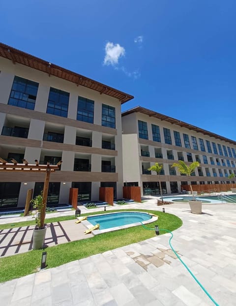 Property building, Day, Pool view, Swimming pool, sunbed