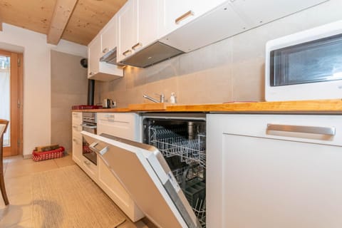 Kitchen or kitchenette, dishwasher, oven, stove