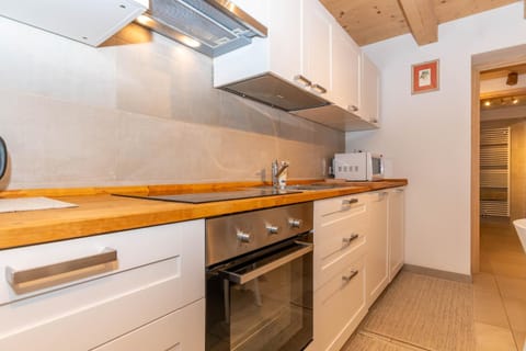 Kitchen or kitchenette, dishwasher, oven, stove