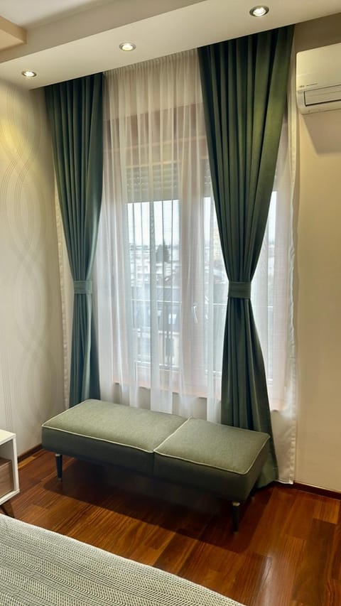 Bed, TV and multimedia, Seating area, Bedroom, air conditioner