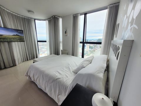 Bed, TV and multimedia, City view