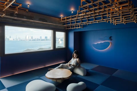 People, Living room, Seating area, Sea view