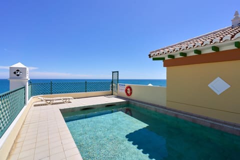 Property building, Living room, Swimming pool