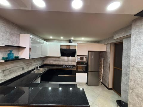 Kitchen or kitchenette, oven, stove