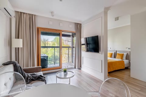 Communal lounge/ TV room, Bed, TV and multimedia, Living room, Photo of the whole room, Seating area, Evening entertainment, Bedroom, hair dresser, air conditioner
