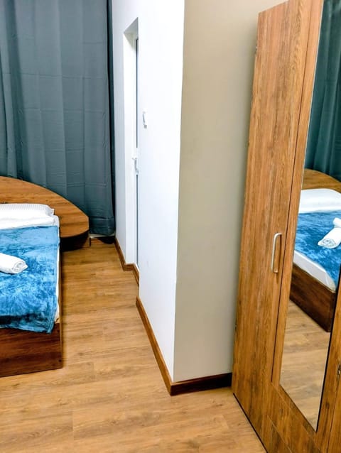 Bed, hair dryier, wardrobe, air conditioner