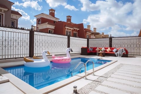 Property building, Patio, Day, Natural landscape, Seating area, Pool view, Swimming pool, sunbed