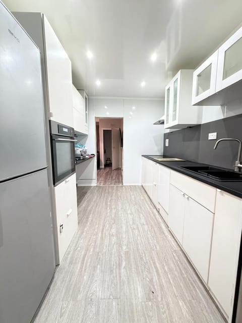 Kitchen or kitchenette, dishwasher, oven, stove