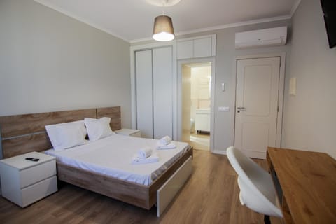 Bed, Seating area, Bedroom, towels, wardrobe, air conditioner