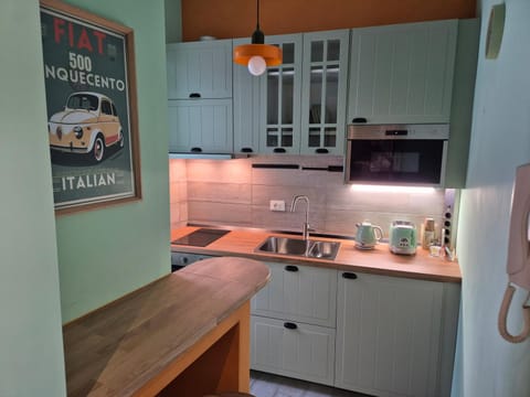 Kitchen or kitchenette, microwave, oven, stove