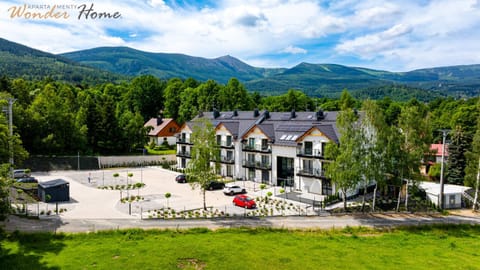 Property building, Spring, Day, Neighbourhood, Natural landscape, Bird's eye view, Mountain view, Parking