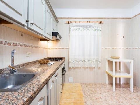 Kitchen or kitchenette, oven, stove