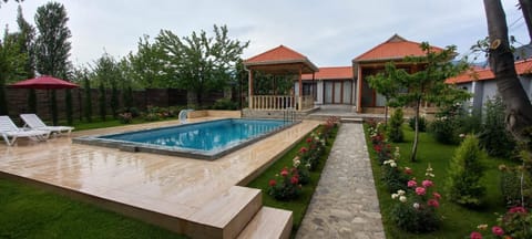 Property building, Patio, Day, Natural landscape, Garden, Garden view, Pool view, Swimming pool, sunbed