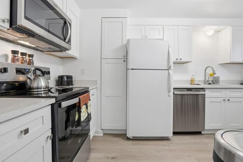 Kitchen or kitchenette, dishwasher, oven, stove