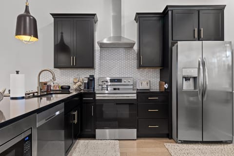 Kitchen or kitchenette, dishwasher, oven, stove, toaster