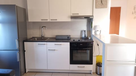 Kitchen or kitchenette, oven, stove