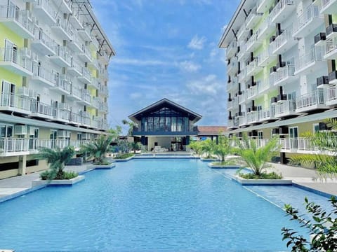 Property building, Day, Natural landscape, Pool view, Swimming pool, Swimming pool, sunbed