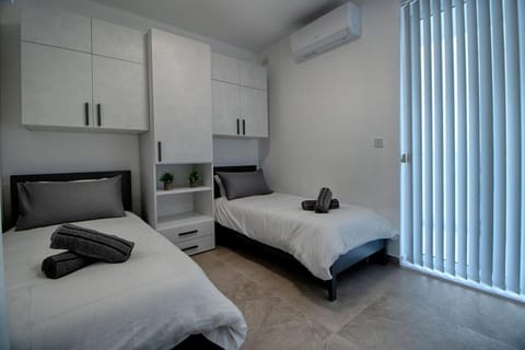 Bed, Photo of the whole room, Bedroom, towels, air conditioner