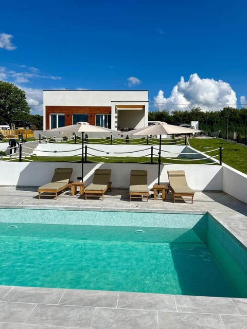Property building, Patio, Swimming pool, sunbed