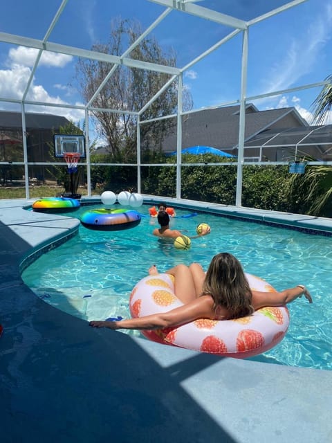 Swimming pool, group of guests, sunbed