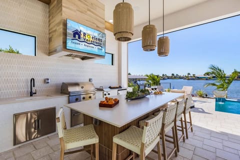 Luxe Waterfront Escape with Heated Pool, Spa & Gulf Access - Villa Solara - Roelens House in Cape Coral