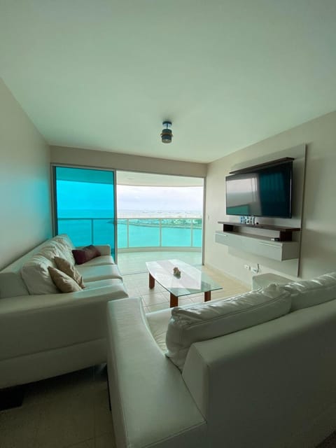 Communal lounge/ TV room, Natural landscape, TV and multimedia, Living room, Seating area, Sea view, air conditioner