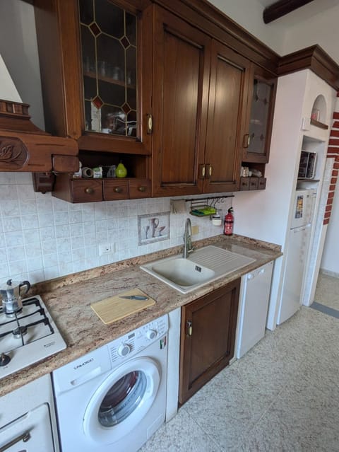 Kitchen or kitchenette, dishwasher, oven, stove, washing machine, dryer