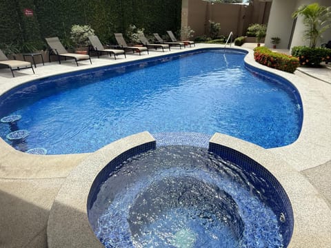 Property building, Day, Pool view, Swimming pool, sunbed