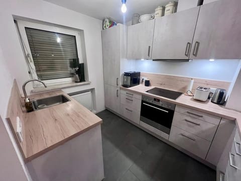 Kitchen or kitchenette, dishwasher, oven, stove, toaster