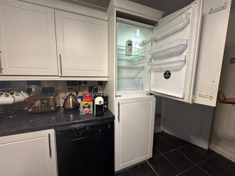 Kitchen or kitchenette, dishwasher, oven, stove