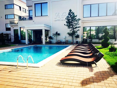 Restaurant/places to eat, Garden, Decorative detail, Beach, Text overlay, Pool view, Swimming pool