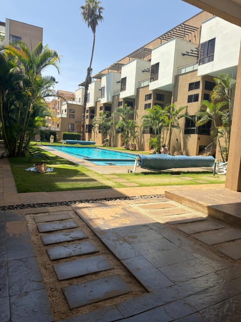 Property building, Day, Pool view, sunbed
