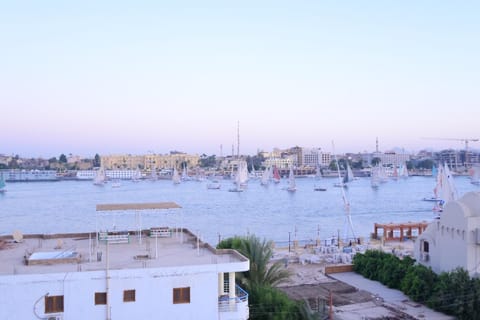 Property building, Nearby landmark, Day, Natural landscape, Activities, City view, River view