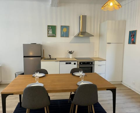 Kitchen or kitchenette, dishwasher, oven, stove