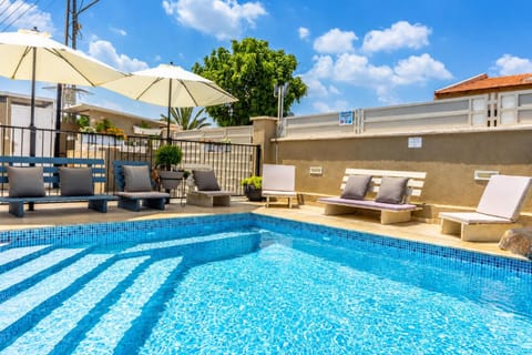Property building, Pool view, Swimming pool, sunbed
