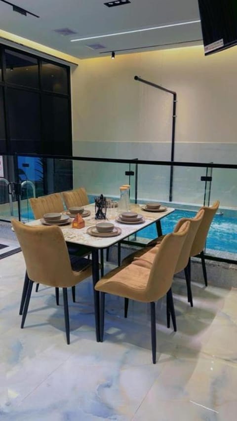 Living room, Seating area, Dining area, Pool view, Swimming pool