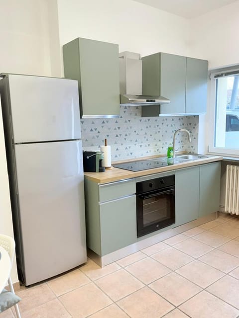 Kitchen or kitchenette, dishwasher, oven, stove