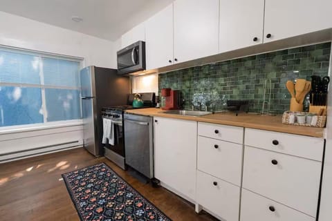 Kitchen or kitchenette, dishwasher, oven, stove