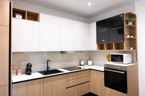 Kitchen or kitchenette, dishwasher, stove, toaster