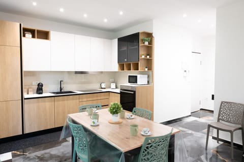 Kitchen or kitchenette, Living room, Seating area, Dining area, oven, stove, toaster