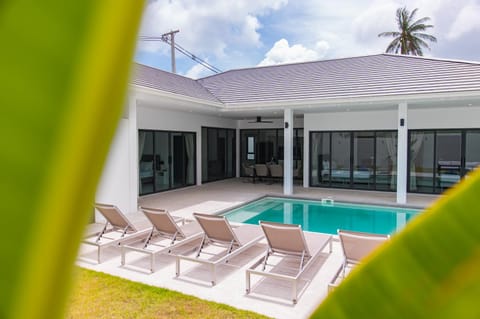Property building, Patio, Pool view, Swimming pool, sunbed