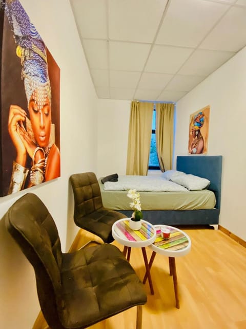 Property building, Bed, Seating area, Bedroom