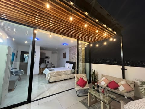 Patio, Bed, Night, Balcony/Terrace, Living room, Photo of the whole room, Seating area, Bedroom, towels