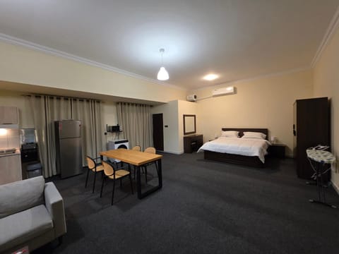 Bed, Photo of the whole room, Dining area, Bedroom, oven, wardrobe, air conditioner