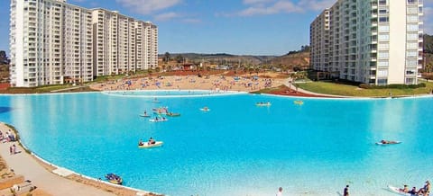 Property building, Nearby landmark, Day, People, Natural landscape, Beach, Lake view, Pool view, Swimming pool, Swimming pool, group of guests